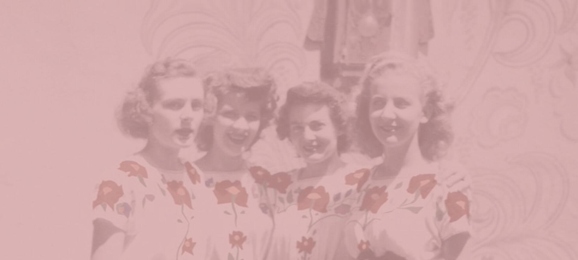 Vintage photo of four women smiling together