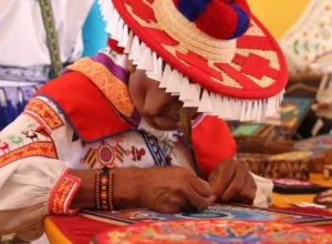 Artist Working on project at The International Folk Art Market.