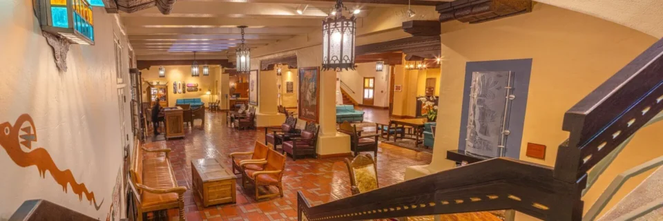 A warm common area exemplifies the historic charm of a Santa Fe boutique hotel.