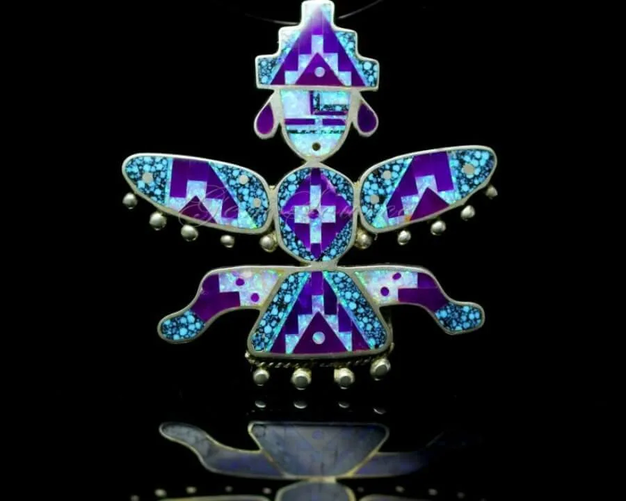 This detailed sterling silver pendant features intricate mosaic inlay of purple stone, opal, and turquoise.