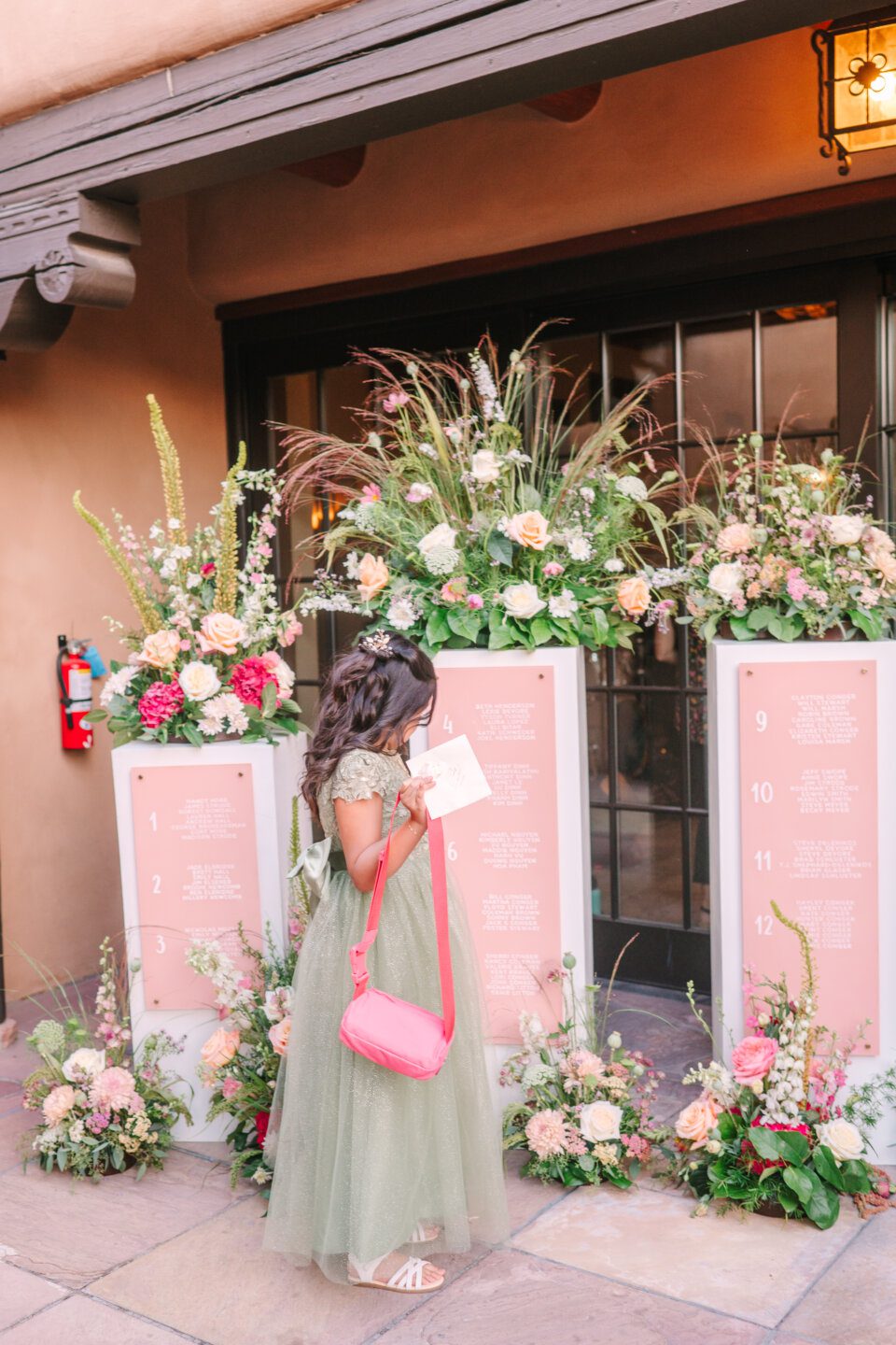 Wedding, Flower girl admires flowers