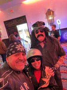 Three people dressed in biker gear.