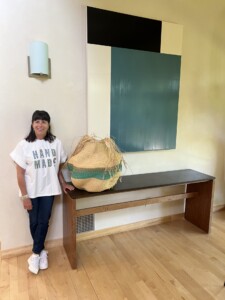 Jenny Kimball standing near a basket.