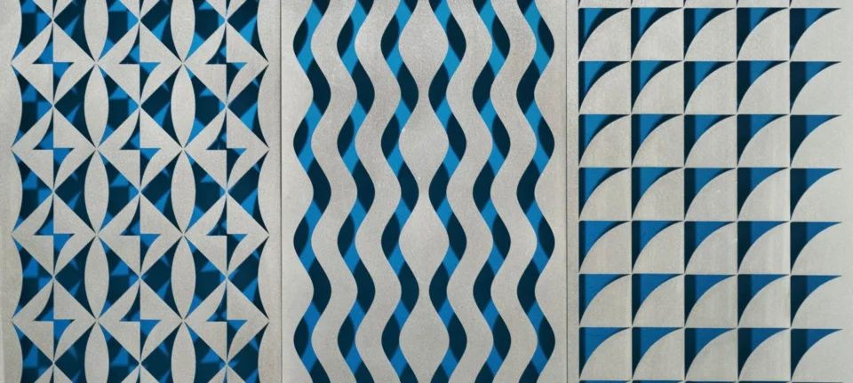 An abstract decorative panel features three vertical strips of repeating geometric patterns in blue and metallic silver.