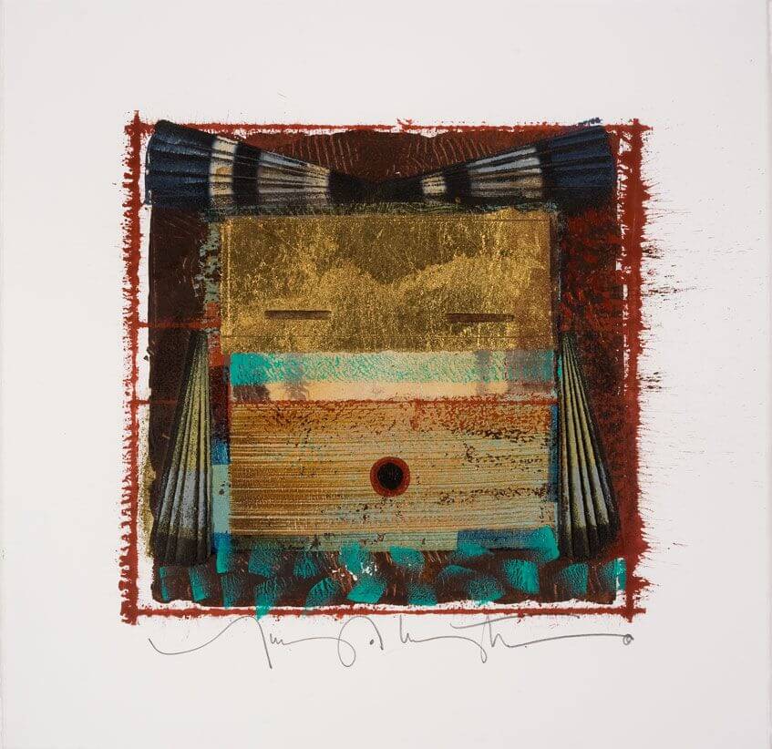 A textured abstract print features a central gold face shape with dark blue fabric details and a red-painted border.