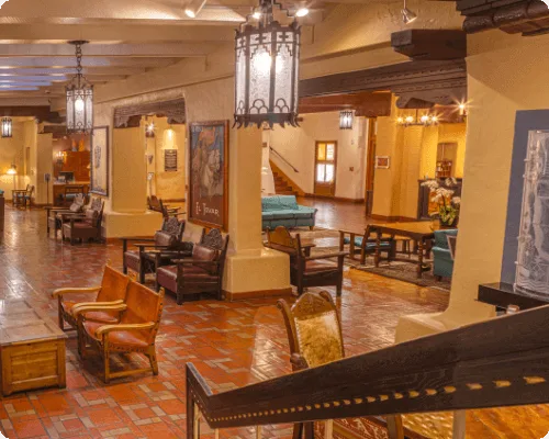 Guests enjoy the comfortable, traditional seating areas within the sprawling lobby of this boutique hotel.
