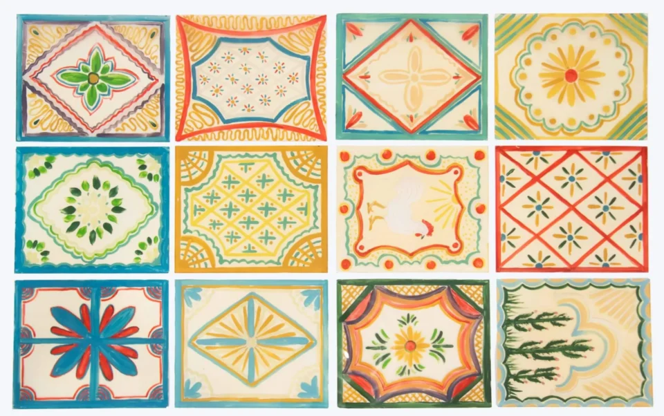 Twelve hand-painted ceramic tiles showcase vibrant, geometric, and floral Spanish Colonial patterns, including one tile.