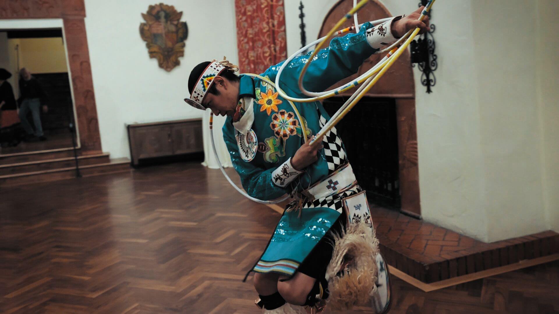 A man performs the Native American hoop dance during a special cultural event.