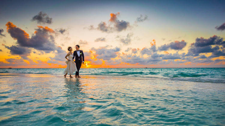 Bride and Groom Walking on the beach in Maldives