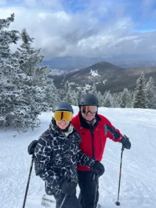 Jenny Kimball and friend skiing at Ski Santa Fe.