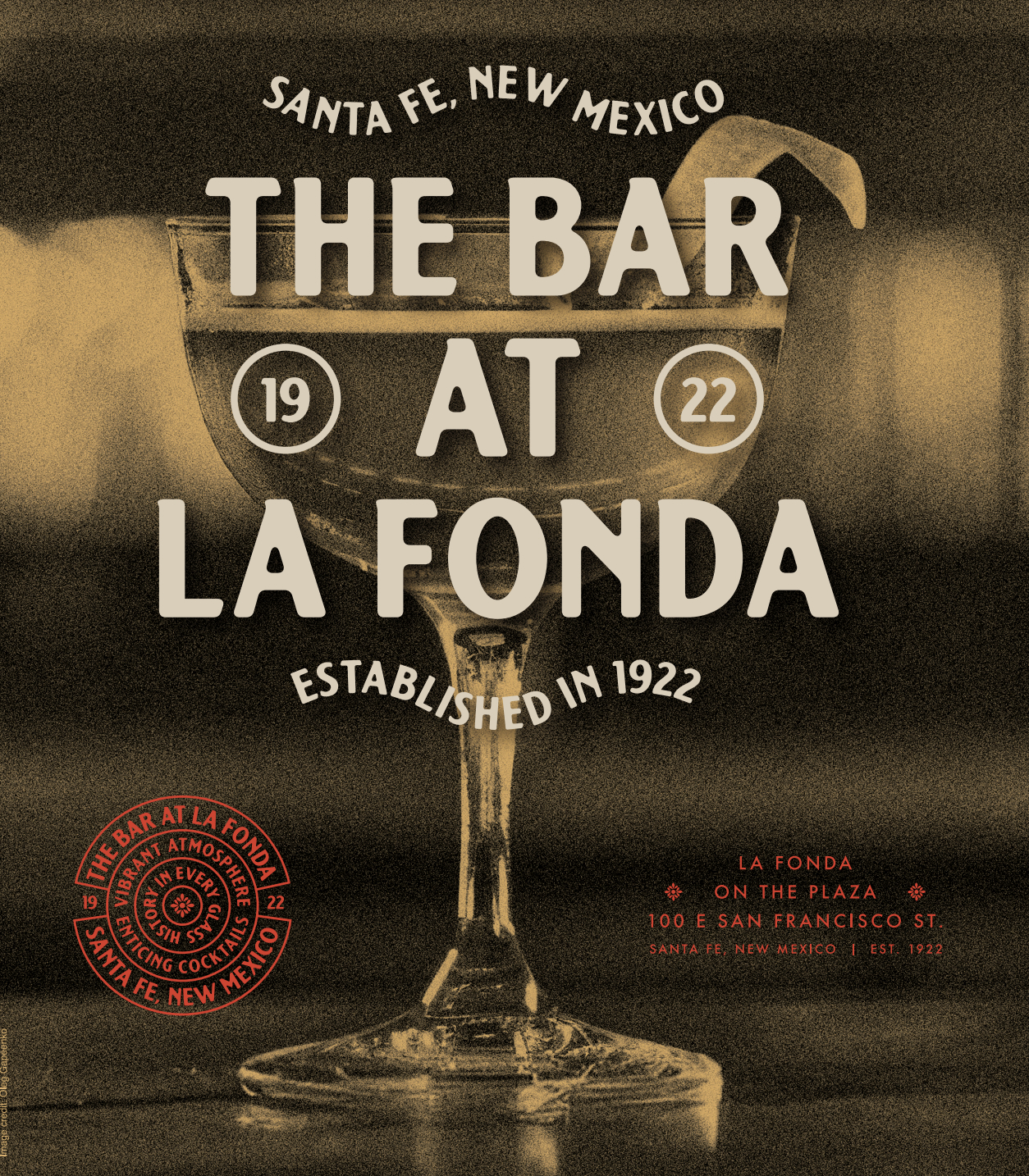 The image depicts a sepia-toned advertisement for "The Bar at La Fonda" in Santa Fe, New Mexico, established in 1922. The ad features a glass of wine with a stem and a logo in the bottom-left corner. The background is a dark, blurry surface.